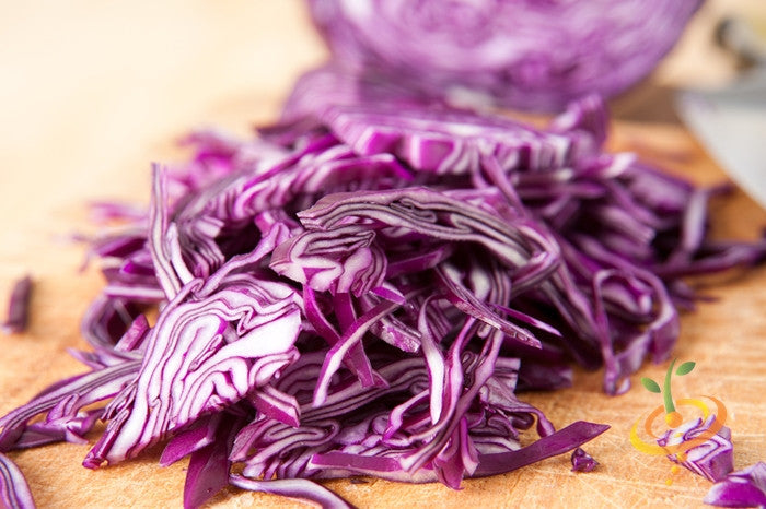 Red Acre cabbage seeds from SeedsNow, showing vibrant red cabbage seedlings in small packets.