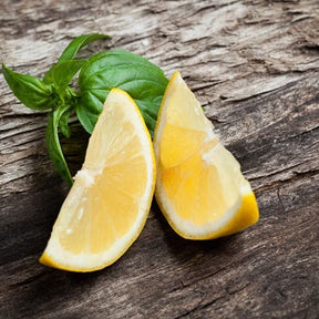 Basil Lemon seeds from SeedsNow, small green seeds for planting basil with lemon flavor, shown on a white background.